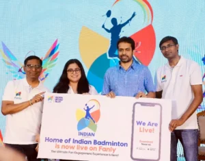 Padma Bhushan Pullela Gopichand and Fanly team members holding a launch banner that reads 'Home of Indian Badminton is now live on Fanly' at the official launch event.