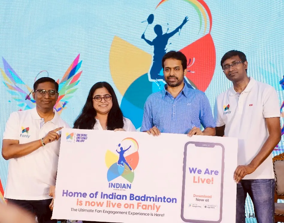 Padma Bhushan Pullela Gopichand and Fanly team members holding a launch banner that reads 'Home of Indian Badminton is now live on Fanly' at the official launch event.