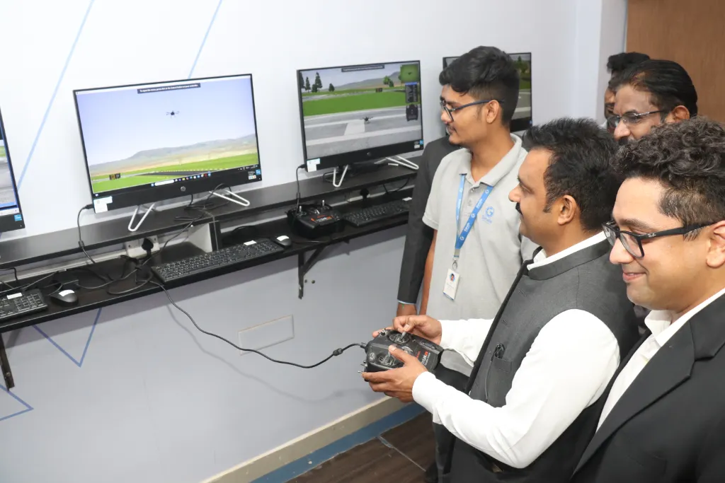 Shri Kamlesh Paswan trying drone flight simulation at Garuda Aerospace’s training zone.