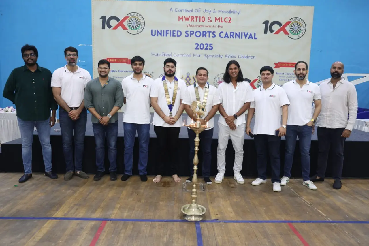 Unified Sports Carnival 2025 inauguration with Somdev Devvarman and MWRT10 members lighting the ceremonial lamp.