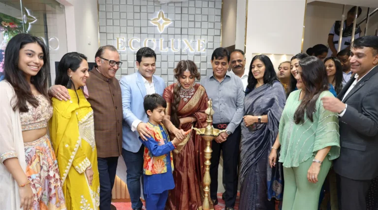 Actress Tejaswi Madivada inaugurates the ECOLUXE diamond jewellery showroom with dignitaries and guests by lighting the ceremonial lamp during the launch event.