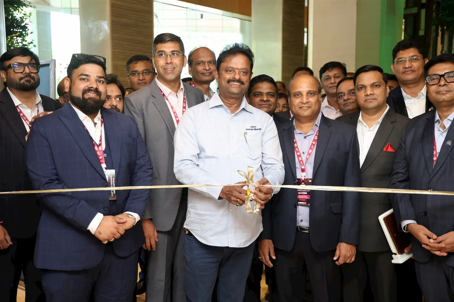 Chief guest cutting the ribbon at the grand opening of the JITO Chennai Pagariya JBN Business Conclave 2025, surrounded by committee members and participants.
