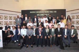 Group photo of Round Table 100 members and donors during the 'Tribute to Superhero 2.0' event hosted by Madras Anchorage Round Table 100, commemorating their milestone initiatives in education and healthcare.