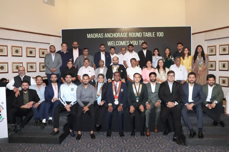 Group photo of Round Table 100 members and donors during the 'Tribute to Superhero 2.0' event hosted by Madras Anchorage Round Table 100, commemorating their milestone initiatives in education and healthcare.
