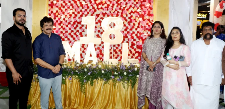 Playback Singer Srinivas, Priyadarshini Kumar, John Cris Terrence and guests at the grand launch of 18 Mall, with a floral backdrop and 18 Mall logo.