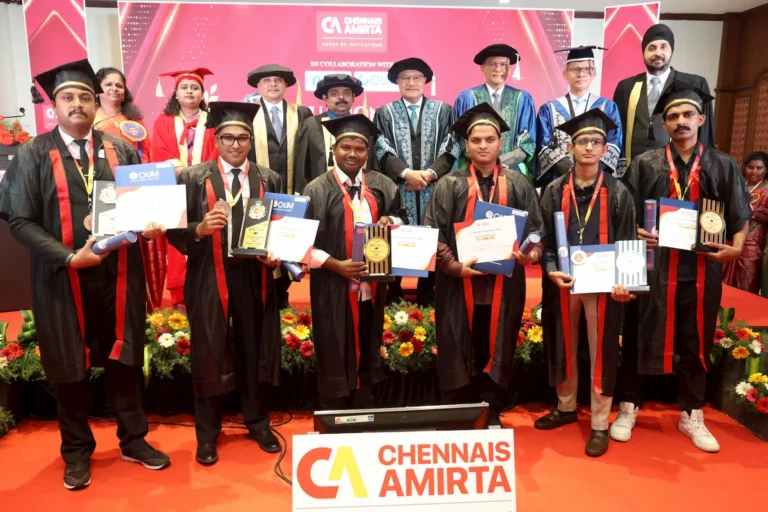 Graduates of Chennais Amirta Group of Institutions proudly holding their certificates and awards during the 9th Graduation Day ceremony in collaboration with OUM Malaysia, alongside dignitaries and faculty members on stage.