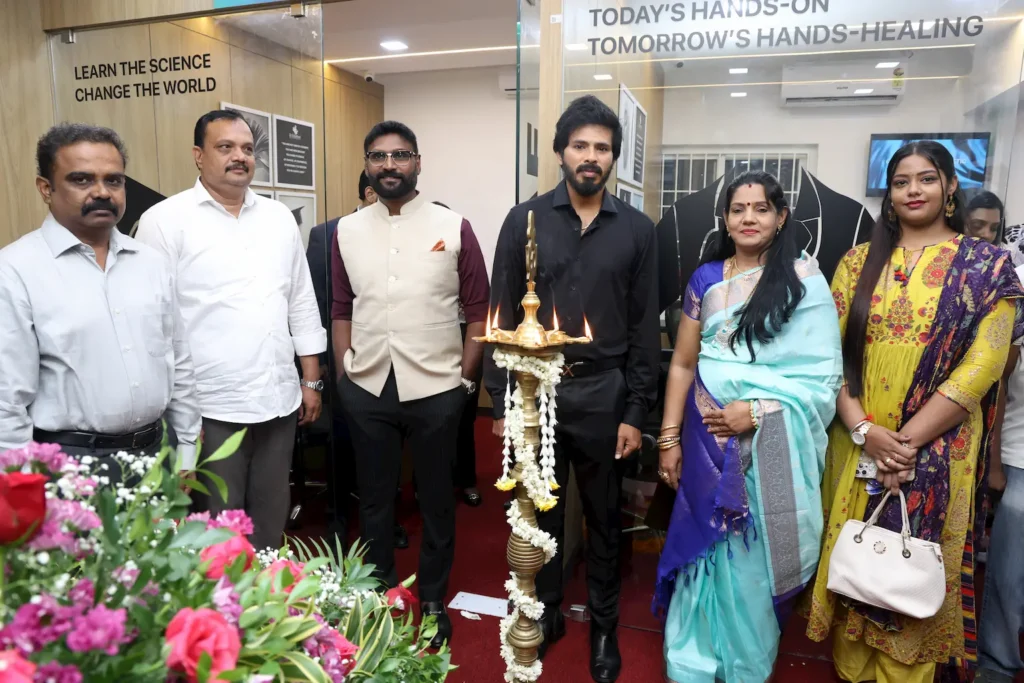 Dignitaries and guests at the inauguration ceremony of Dr. Edumed Academy's Anna Nagar branch, standing beside a traditional lamp with floral decorations.