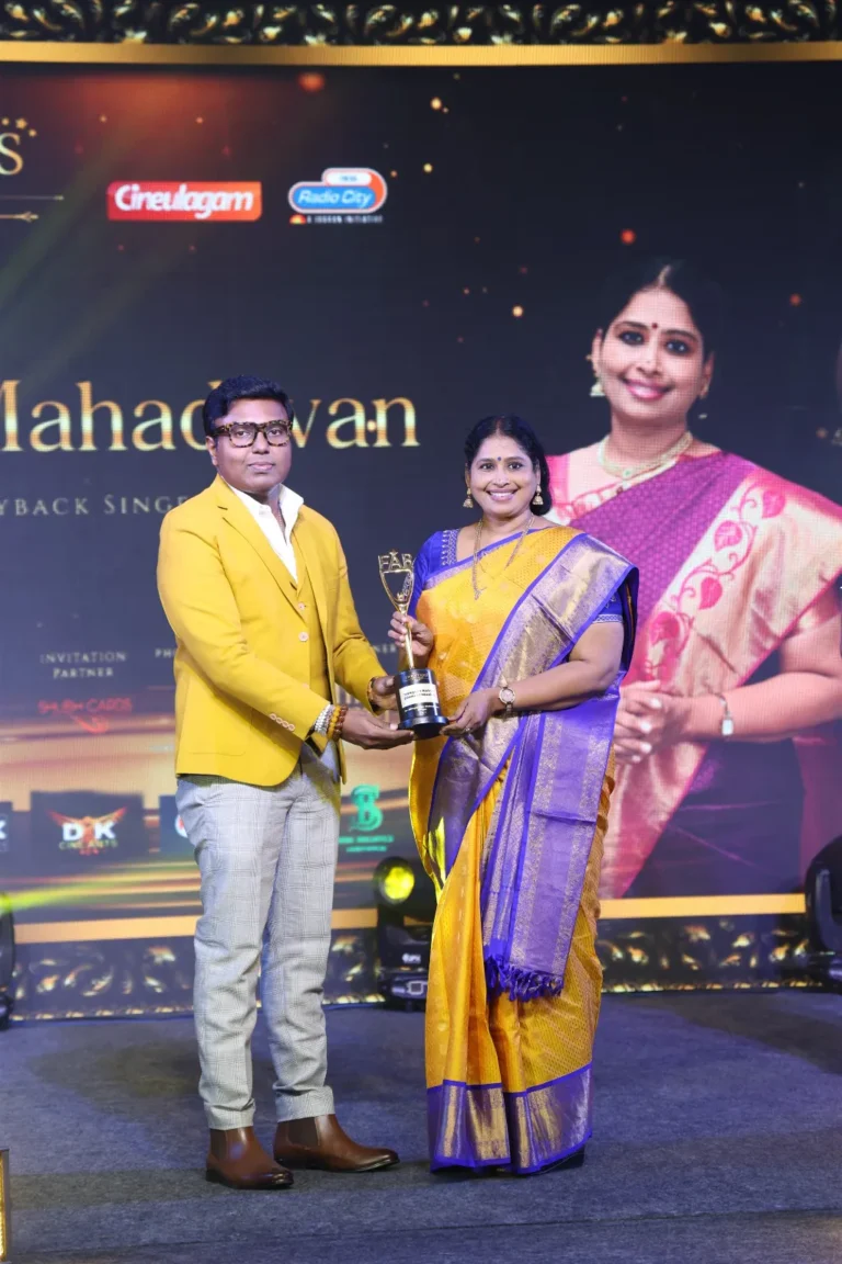 D. Imman presenting the Fab Stars Iconic Award to singer Nithyashree Mahadevan