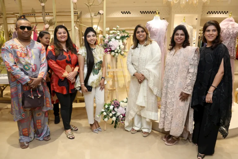 Group photo at the Fusion Edit launch of Awigna by Eleganzaa in Alwarpet, featuring designers, guests, and curators in elegant festive attire inside the multi-designer store.