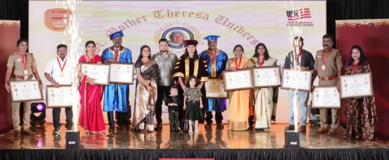 Recipients of the Honorary Mother Theresa Awards pose with certificates on stage during the ceremony organized by St. Mother Teresa University at Hotel Vijay Elanza, Coimbatore.