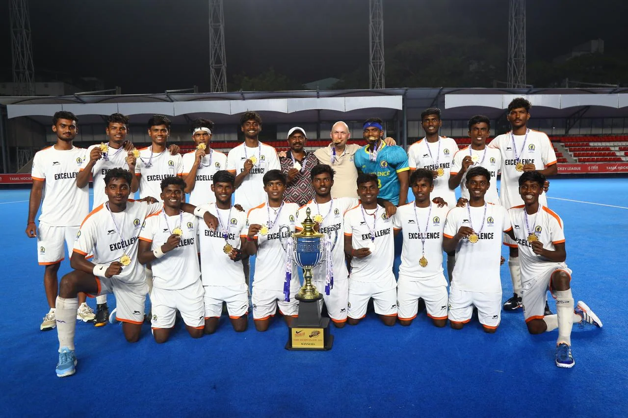 SDAT Sports Hostel of Excellence men's hockey team celebrating with medals and trophy after winning THL 2026