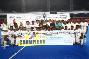 SDAT Sports Hostel of Excellence receiving Rs 1 lakh winners cheque and Champions Trophy at THL 2026 final