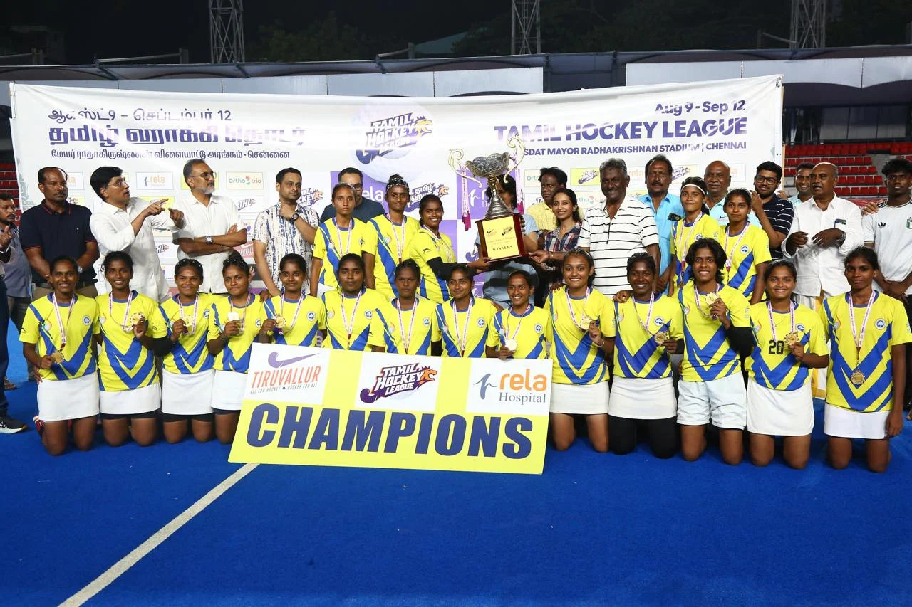 SRM Institute of Science and Technology women's team receiving Champions Trophy at THL 2026 women's final